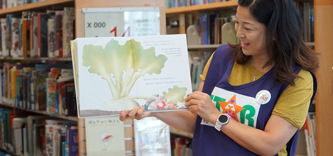 star reader holding a book