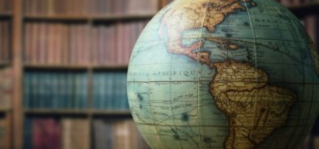 globe in front of a book case