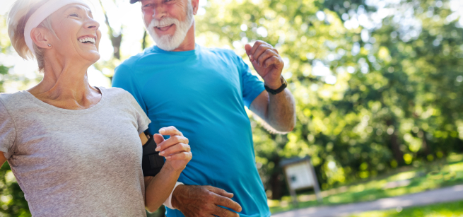 older couple jogging with man wearing a blue shirt and woman wearing a white shirt