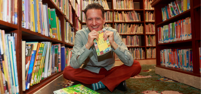 a man in a library with books