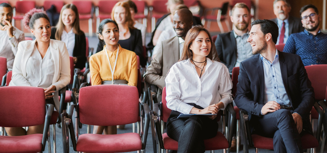 An audience listening to a lecture.