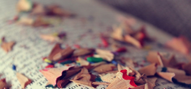 colored pencil shavings on a book page