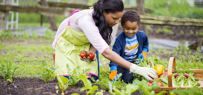 a mom and a child gardening plants