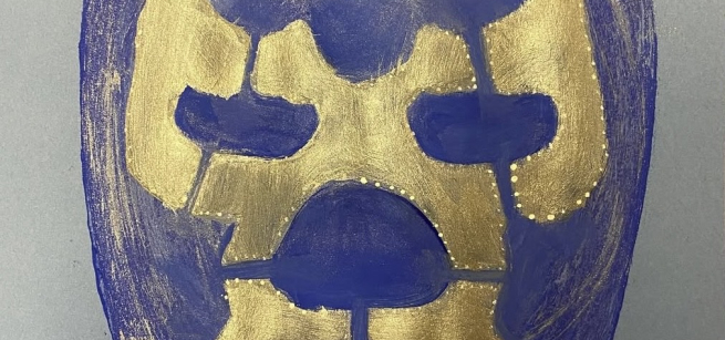 lucha libre mask painted in purple and gold