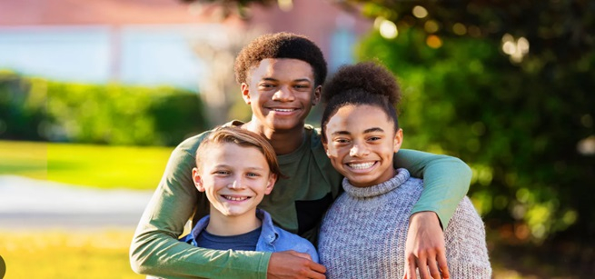 Two young adults and one child