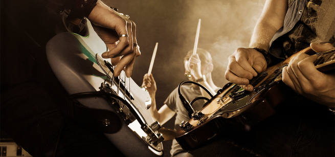 Hands of musicians shown strumming electric guitars.