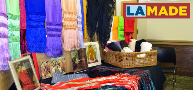 colorful rebozos on display in a library