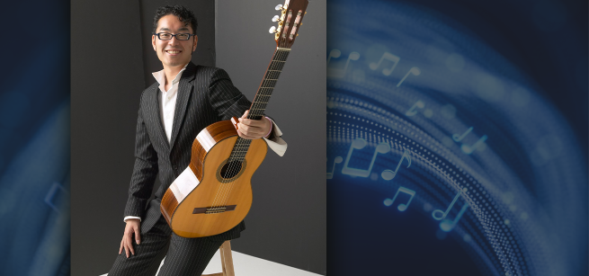 taro holding a guitar