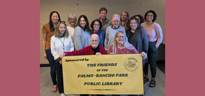 people standing with friends of the library sign