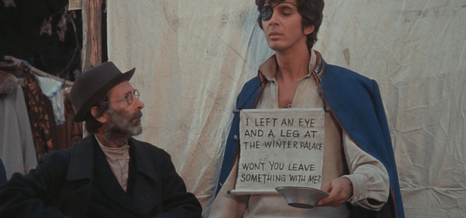 film scene beggar holding sign asking for donation 