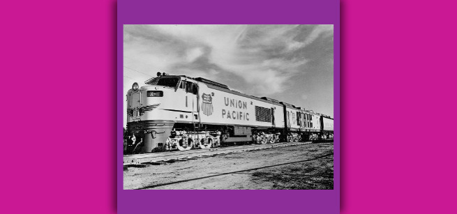 Black and white photo of gas turbine locomotive operated by the Union Pacific Railroad circa 1965 on a colorful background.