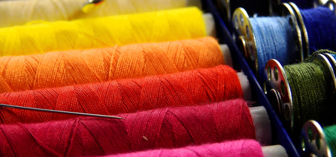 different color so string from yellow, orange, red, pink, white,black,light blue to green and a pair of small scissors