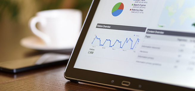 A computer screen shows various graphs and charts