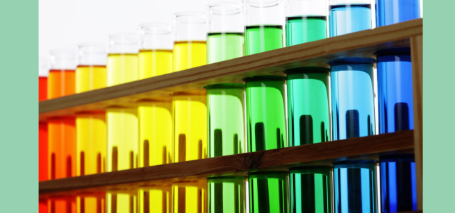 A rainbow gradient line of test tubes with liquid inside of them with 2 teal borders
