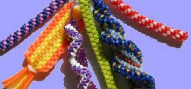 A display of six braided colorful lanyards. 