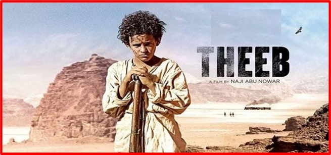 Young boy standing in the desert holding a rifle