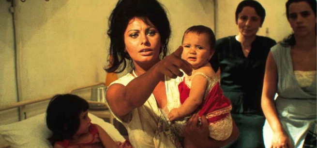 Sophia Loren is holding a child 