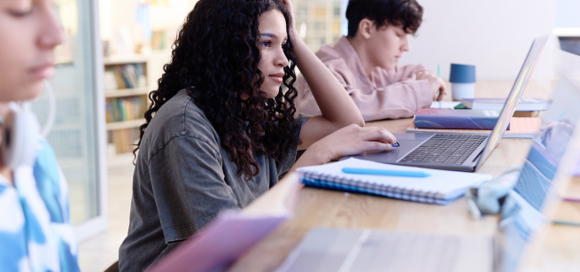 Image of students studying and using laptop
