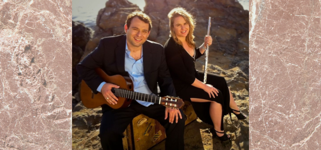 Flutist and guitarist sitting in front of a rocky landscape.