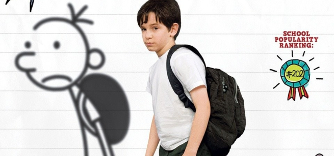 picture of a boy standing next to a doodle
