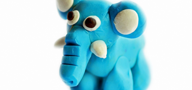 a blue elephant made out of clay