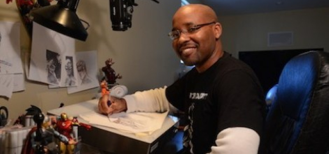 Illustrator Evan Burse at his drawing desk. 