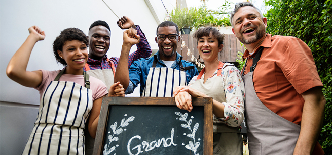 Men and women celebrating and smiling
