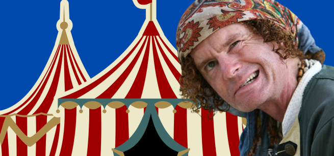 Christopher Yates in front of a white and red stripped circus tent
