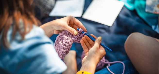 Close up of a woman crocheting