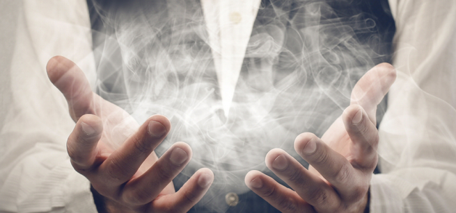 hands with wispy smoke floating out of them like magic