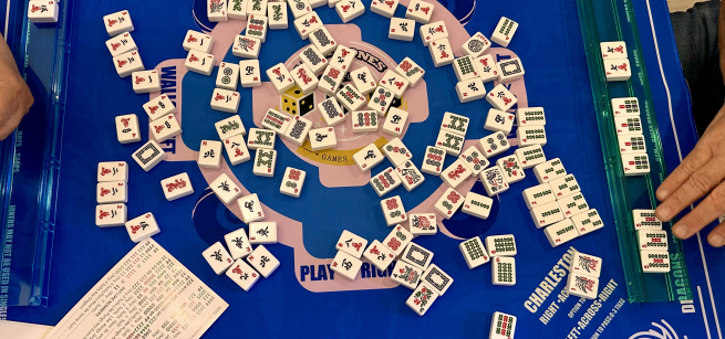 Image of Mah Jongg tiles being played mid-game.