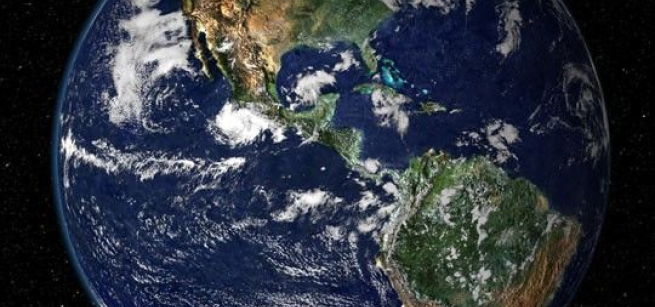 Earth and the moon against a the blackness of space 