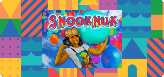​​A colorful geometrical background borders an image of the performer, Snooknuk, holding a huge bouncy ball over her shoulders as a cascade of multi-colored balloons floats behind her. 