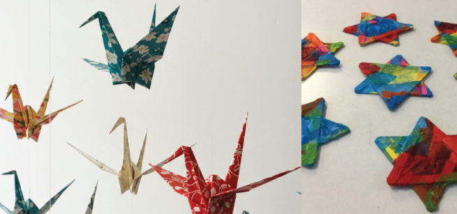 hanging paper cranes and Star of David ornaments