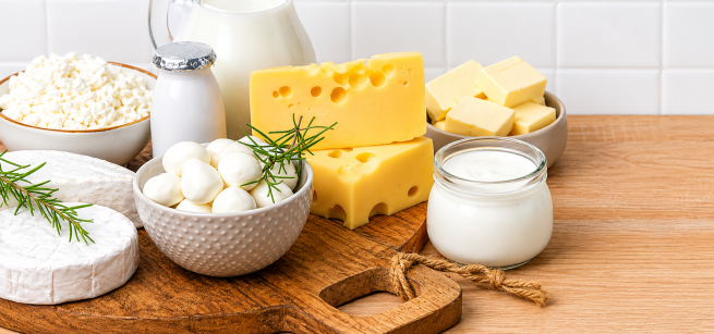 Yogurt, butter and cheese on a table