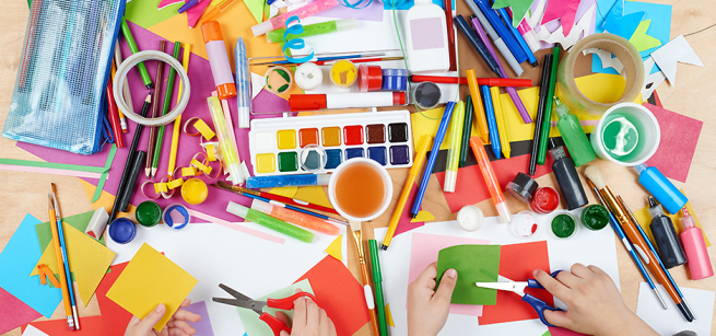 Colorful art supplies on a table.