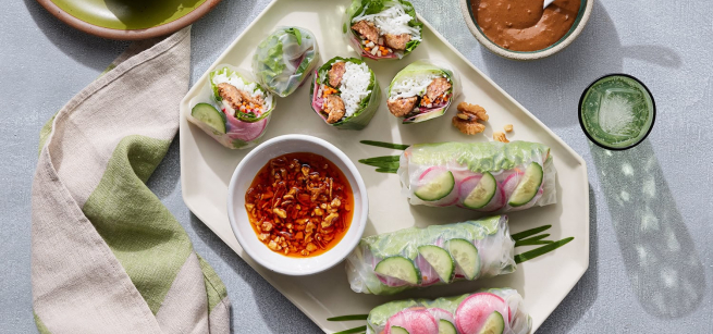 Spring rolls on plate with two dipping sauces