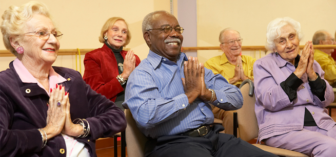 Seniors Exercising on chairs