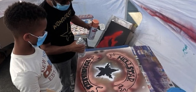 Spray painting a sign