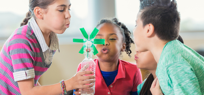 Kids doing a science experiment.