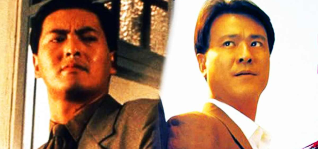 two men in suits standing next to another shoulder to shoulder 