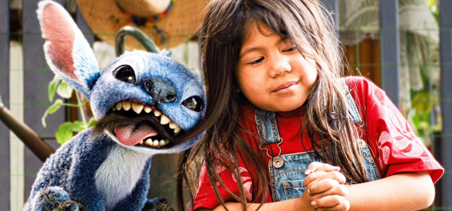 blue character and little girl next to each other