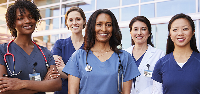 medical professionals wearing scrubs and a lab coat