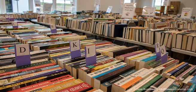 assorted books displayed for a book sale