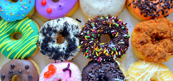a dozen colorful donuts