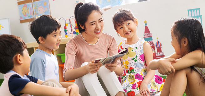 young woman volunteer with four students