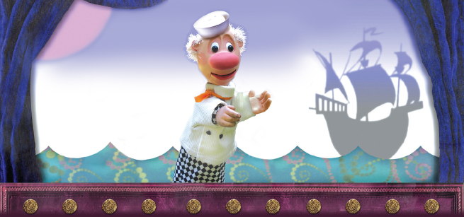 sailor puppet with a ship in the background