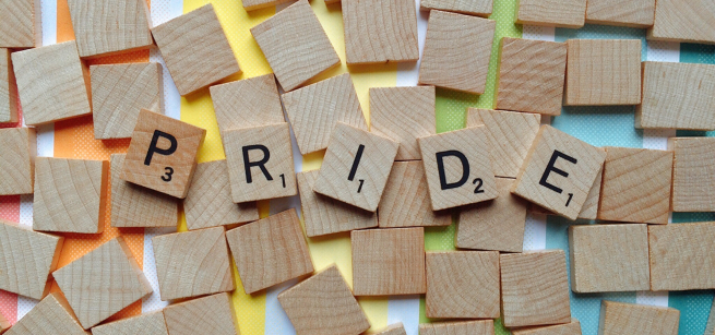 Scrabble letters that spell PRIDE