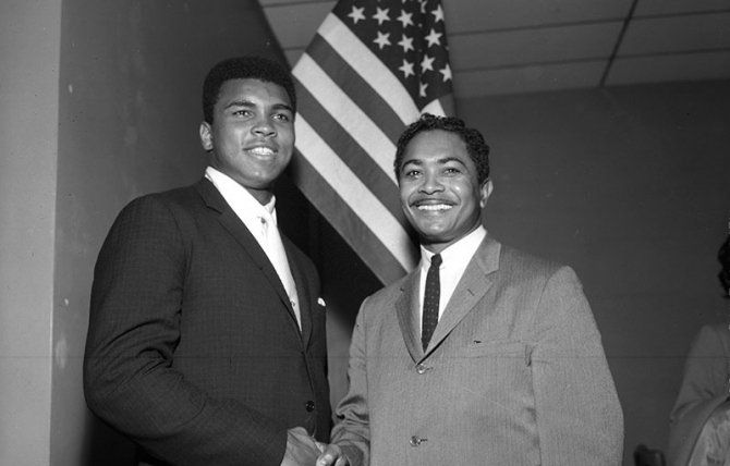 Mervyn Dymally (right) meets Muhammad Ali (left) at a Compton NAACP meeting in 1966.