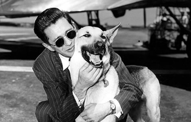 Blind ex-GI Edward M. Goodman reunited with seeing-eye dog “Trump” at United Airport after being separated two months. June 10, 1948